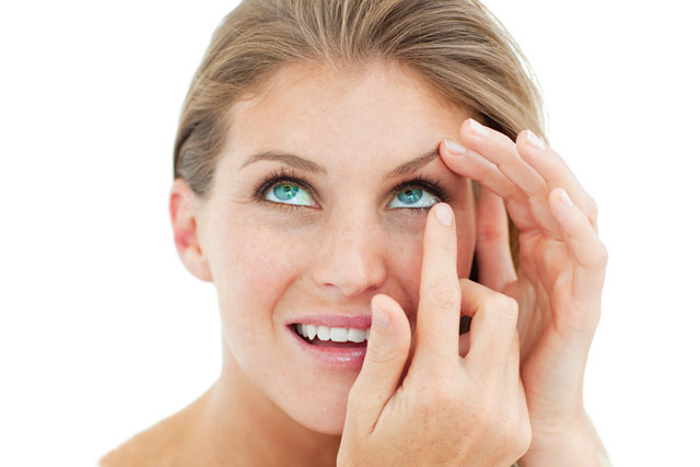 Woman inserting contact lens - Optometrist - Fairfax, VA